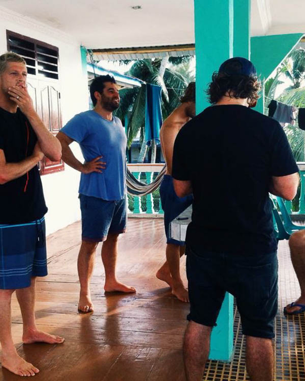 Guests relaxing together at Raffiel Nias after a surf session